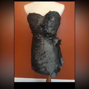 Very pretty grey strapless dress.